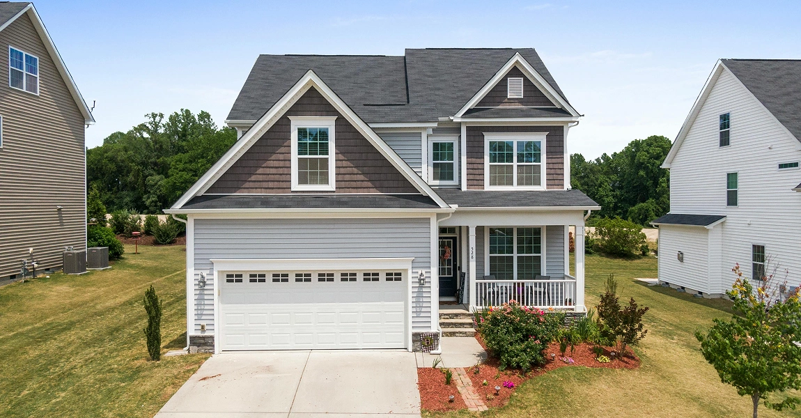 Sunbury, OH home featuring new vertical siding installation and energy-efficient windows by Columbus Windows & Siding