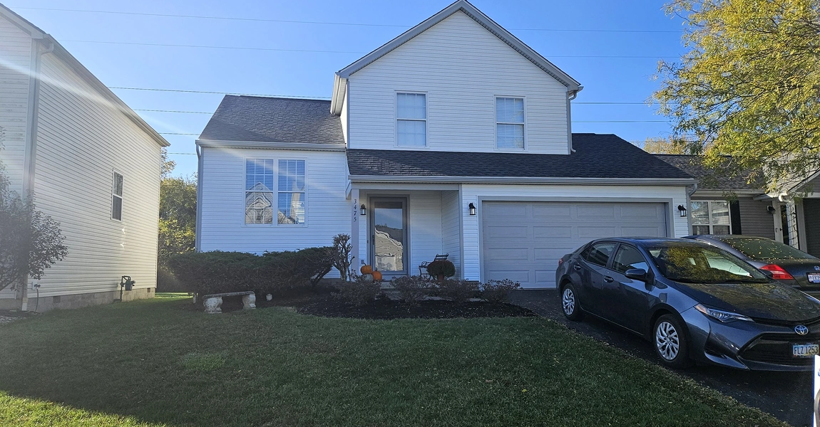Pickerington, OH home featuring farmhouse board and batten siding and new roof installed by Columbus Windows & Siding