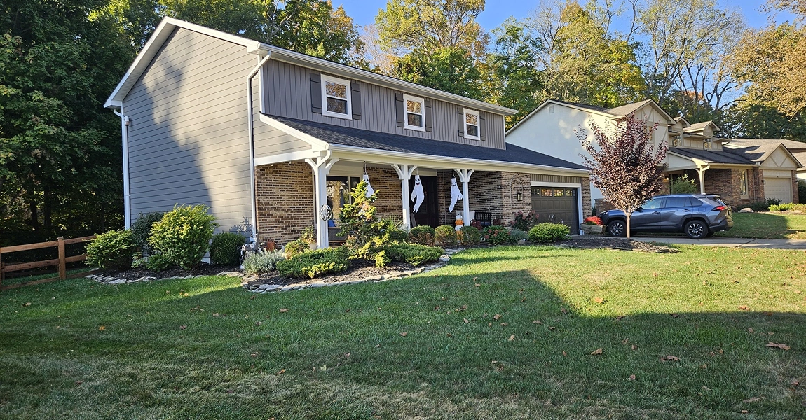 Powell, OH home with vibrant vinyl siding planks and board and batten accent siding installed by Columbus Windows & Siding